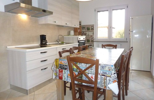 Porto Valtravaglia Apartment | Apartment 'Sunset On Lake Maggiore 2 Garages' with Garden, Balcony and Wi-Fi