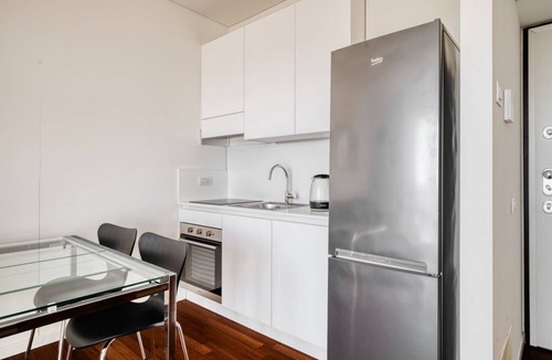 Dergano Apartment | Elegant two-room apartment in Milan on the 5° floor with elevator for 4 guests, with double bedroom, living room with sofa bed and fully equipped kitchen. Large furnished balcony with city views. The modern palace offers a swimming pool, gym and hot tub