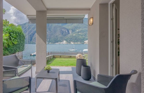Lezzeno House | GuestHost - A modern 83 sqm ground floor apartment, ideal for two people, with direct access to Lake Como!The property is located in Lezzeno (Carvagnana), conveniently located for amenities and featuring private parking.The apartment comprises a living r