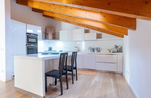 Cesana Brianza Apartment | GuestHost - Travel with your family and friends and explore lakes and mountains near Como!This large attic, with two bedrooms, two bathrooms, open space kitchen with island, large living room, terraces and patio for relaxing, is located on the road that