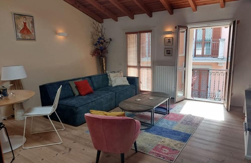 Arona Apartment | Luxury apartment in the heart of Arona, just steps from the lake and just 10 meters from Via Cavour, Arona's main shopping street with boutiques, restaurants, and shops for every need. This beautiful two-room apartment features wood and stoneware floors