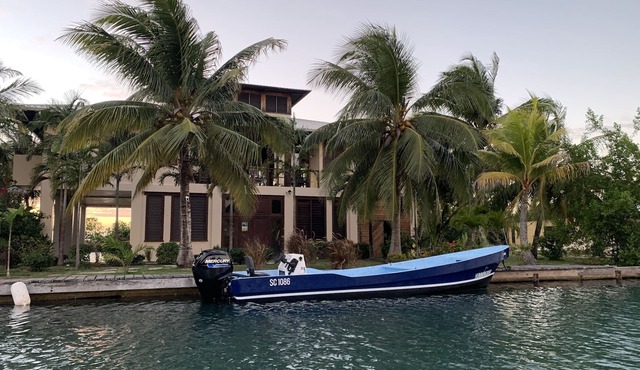 Beautiful Beachfront Island Home, Private Dock, Village Transportation Included in Placencia