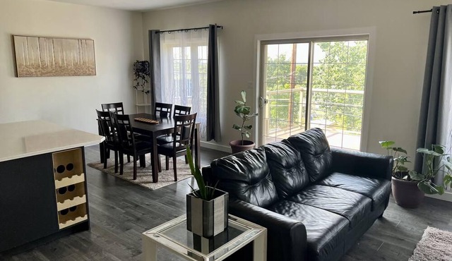 spacious 5 bedroom home with a game room, walk-in basement, and overlooking deck in Prince Albert